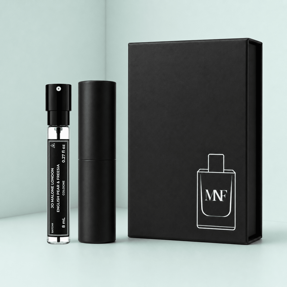 MNF 8mL travel spray, black travel case, and gift box shown for JO MALONE LONDON English Pear & Freesia Cologne.