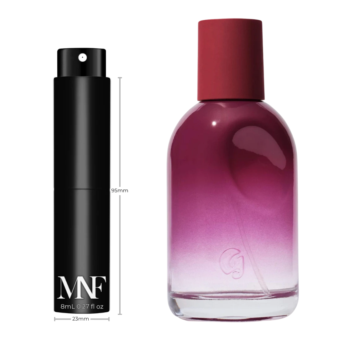 My Next Fragrance 8mL travel spray next to a Glossier You Rêve eau de parfum bottle on a black background.