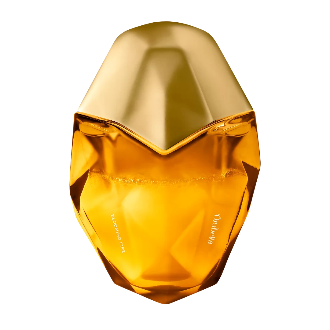 My Next Fragrance Ôrəbella Blooming Fire warm floral parfum in a faceted amber glass bottle with a gold cap