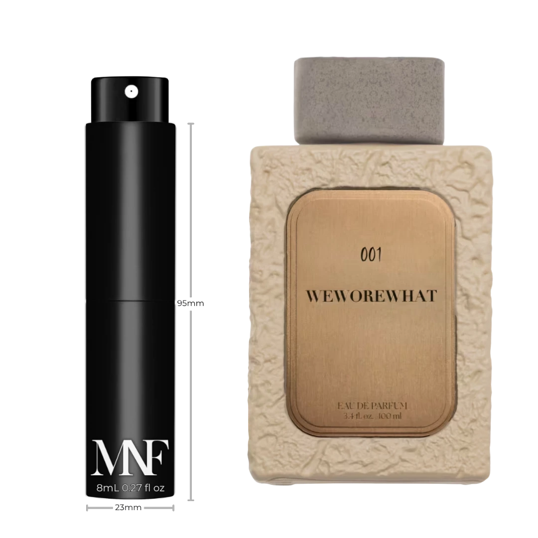 My Next Fragrance 8mL travel spray of WeWoreWhat 001 unisex woody gourmand eau de parfum next to full-size bottle.